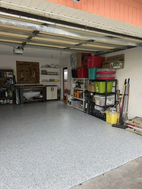 Garage cleanout after in Dunedin, FL — cleared and organized with coated floor