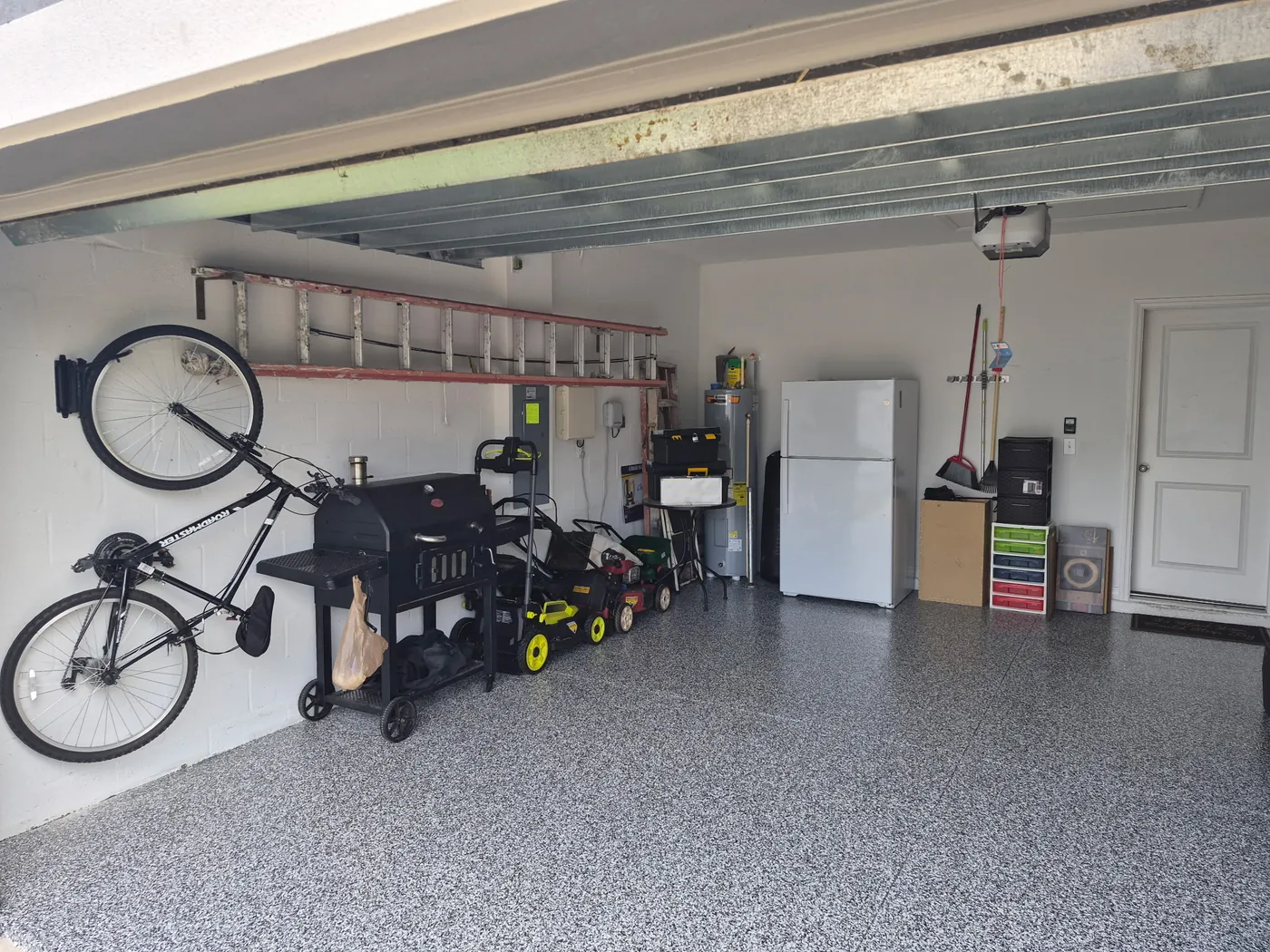 Garage cleanout after in Tampa Bay, FL — a cleared, organized garage with room to park by Apex Garage & Exterior Solutions