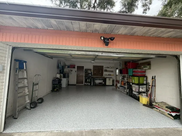Garage floor coating after in Dunedin, FL — gray flake polyaspartic finish